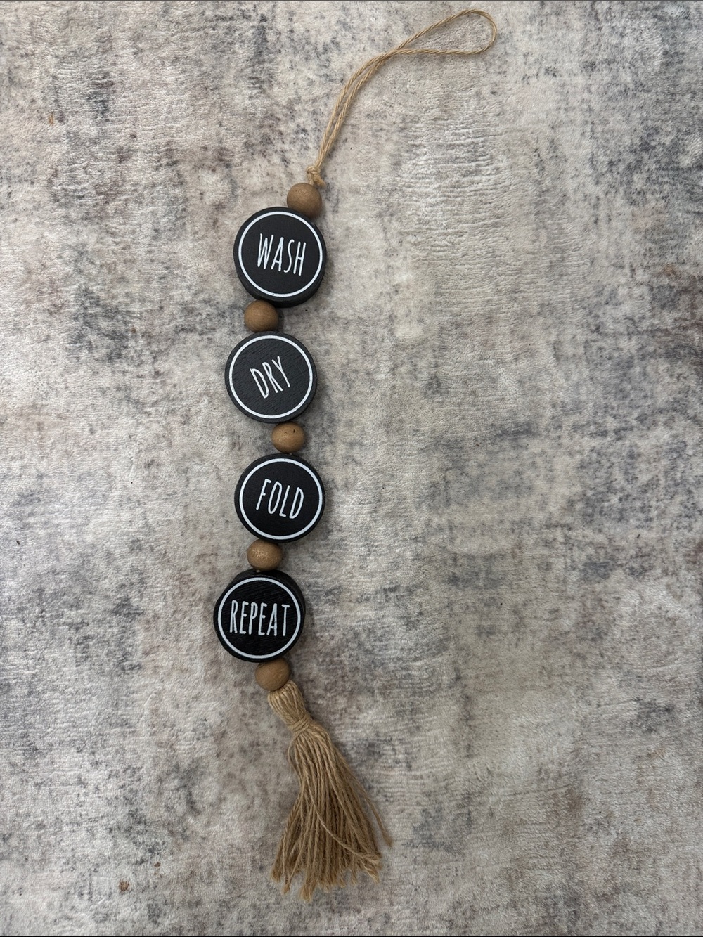 Black 'Wash Dry Fold Repeat' Hanging Wall Decor